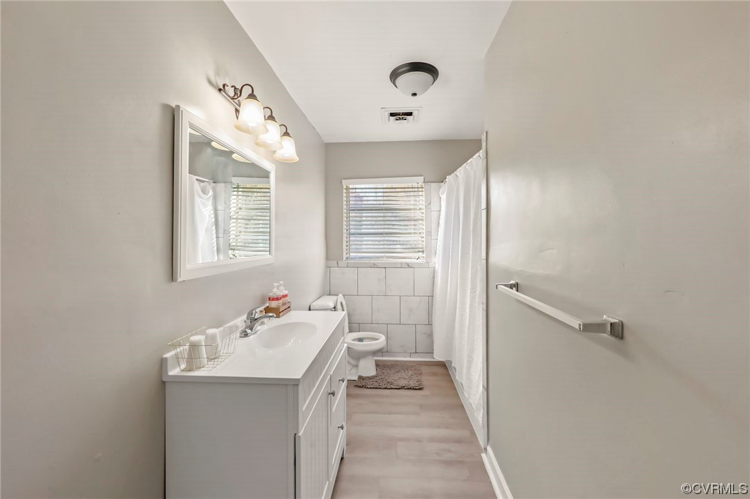 3248 West Hundred Road Chester, VA 23831 - Photo 20 of 27 a bathroom with a sink a mirror and a shower