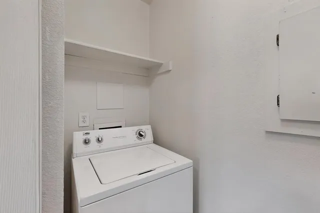 a view of storage and utility room with washer and dryer