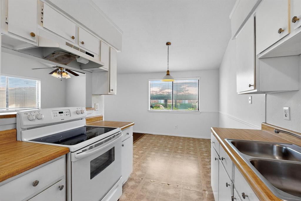 2240 Tarpley Road, Unit 242 Carrollton, TX 75006 - Photo 14 of 30 a kitchen that has a sink and a stove