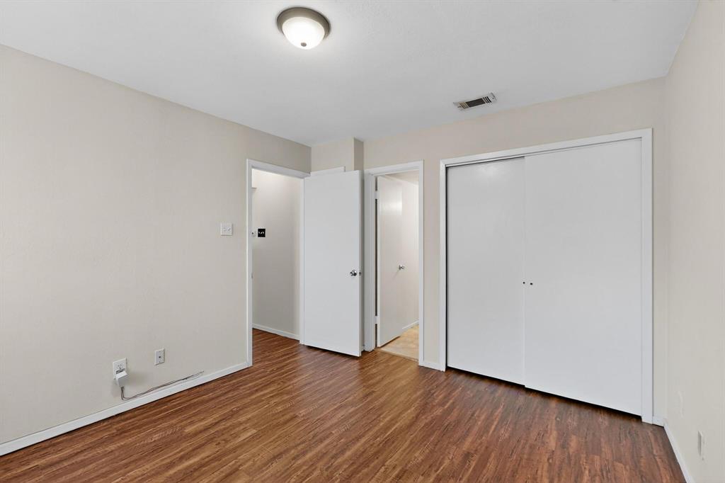 2240 Tarpley Road, Unit 242 Carrollton, TX 75006 - Photo 20 of 30 a view of an empty room with wooden floor