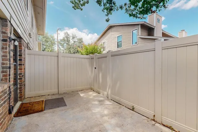 a front view of a house with plants