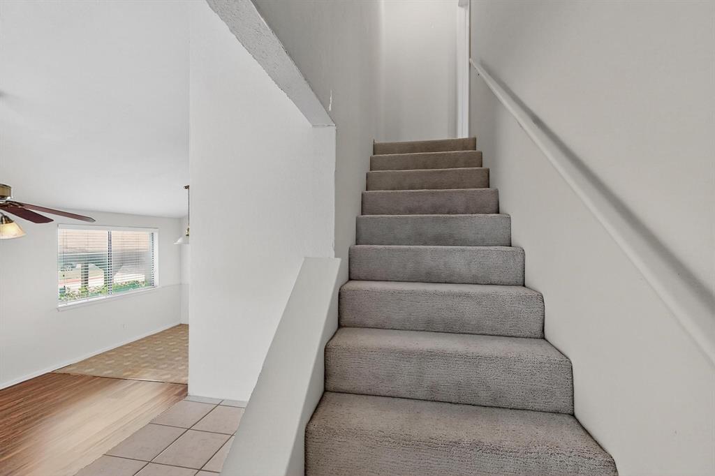 2240 Tarpley Road, Unit 242 Carrollton, TX 75006 - Photo 24 of 30 a view of staircase with white walls and windows