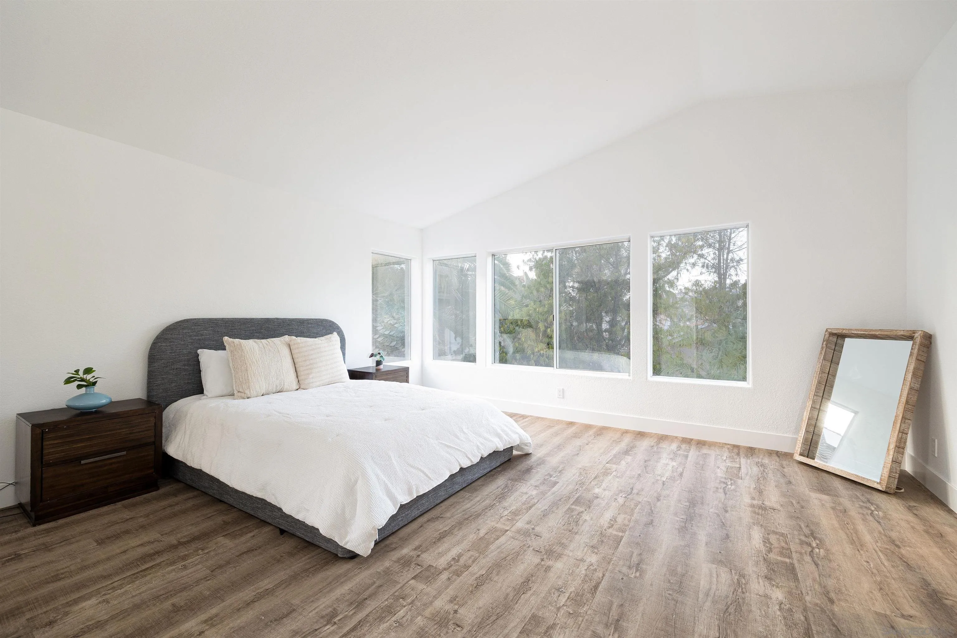 2318 Via Villegas Carlsbad, CA 92009 - Photo 11 of 37 a bedroom with a large bed and a large window