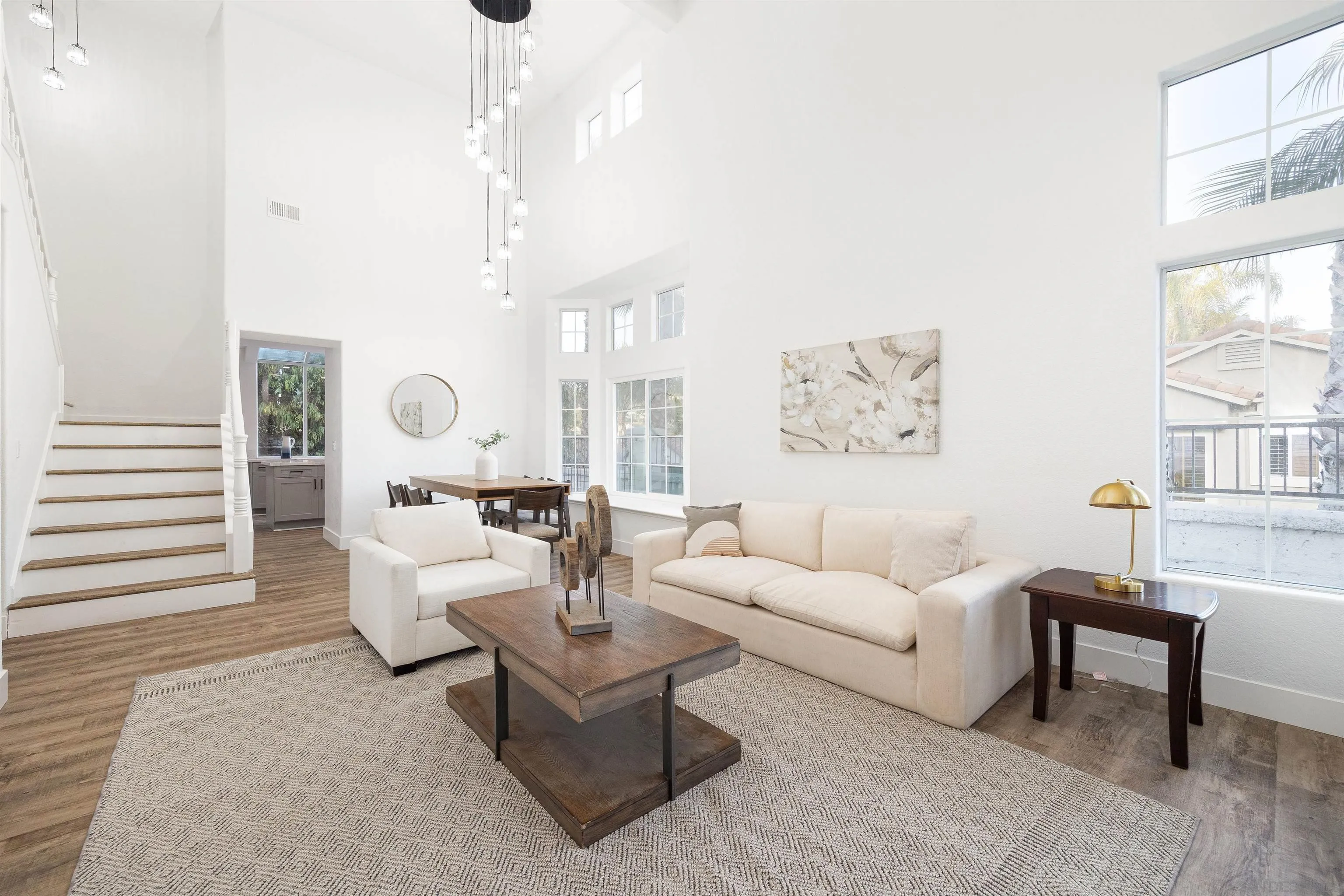 2318 Via Villegas Carlsbad, CA 92009 - Photo 3 of 37 a living room with furniture and a chandelier