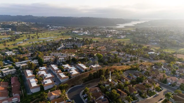 an aerial view of residential building with parking space