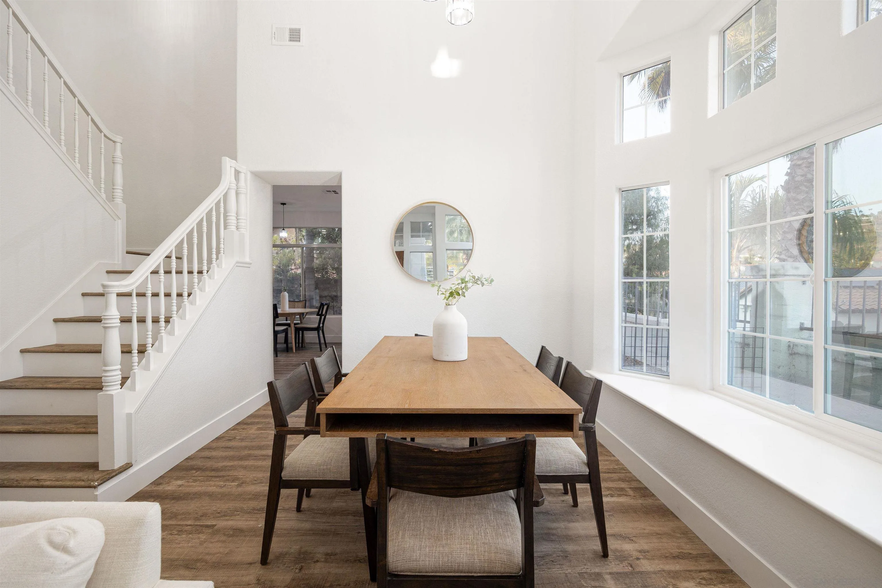2318 Via Villegas Carlsbad, CA 92009 - Photo 5 of 37 a view of a dining room with furniture window and wooden floor