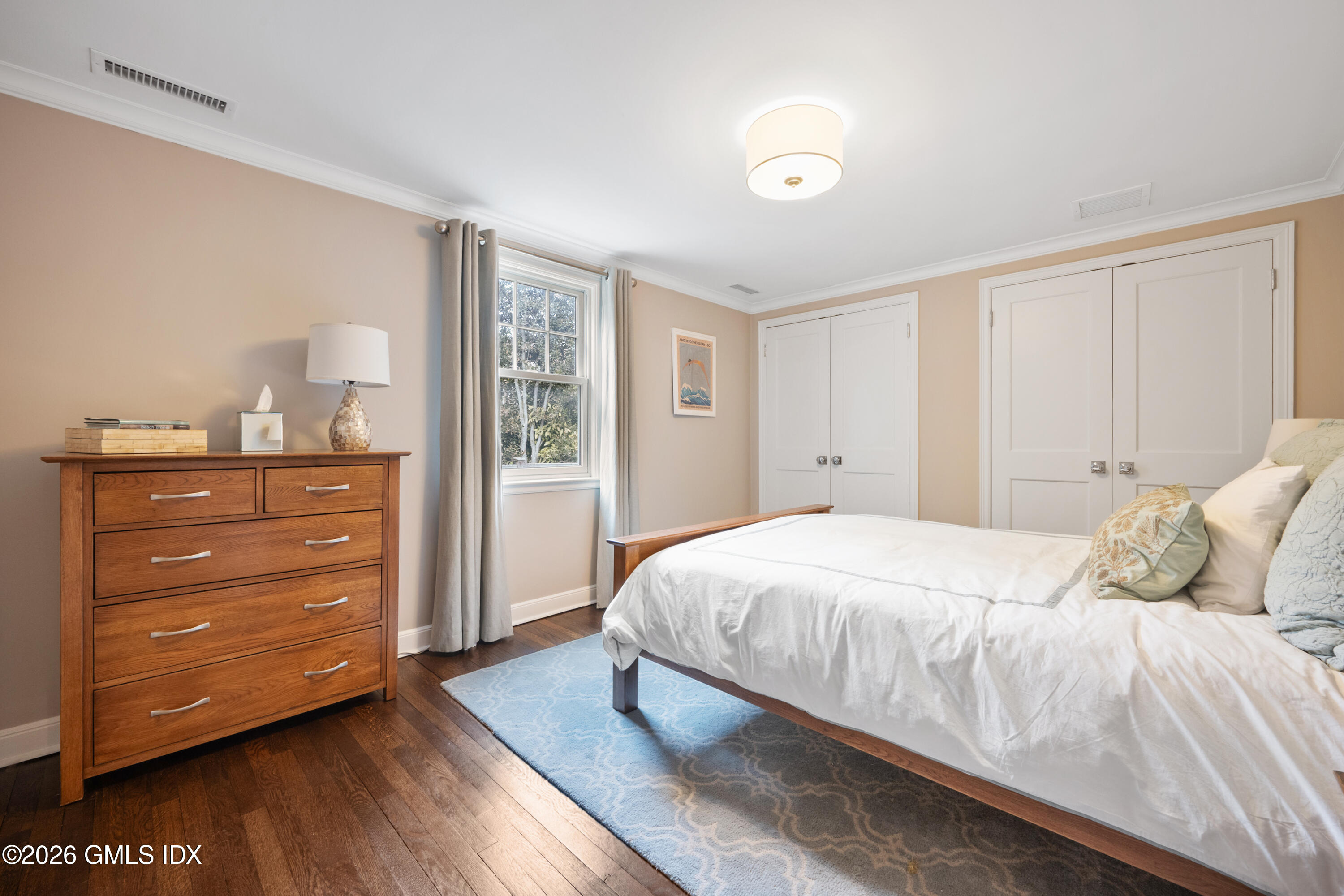 15 Pell Place Riverside, CT 06878 - Photo 26 of 35 a bedroom with a bed and a dresser