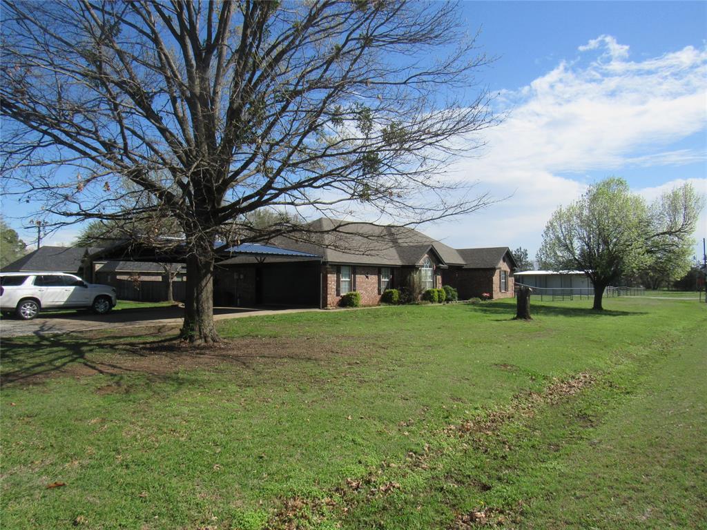 4019 East Fm 120 Denison, TX 75021 - Photo 1 of 39 a view of a house with a yard