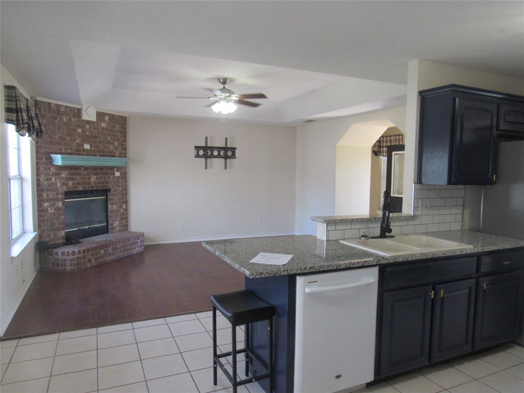 4019 East Fm 120 Denison, TX 75021 - Photo 14 of 39 a kitchen with a sink cabinets and appliances