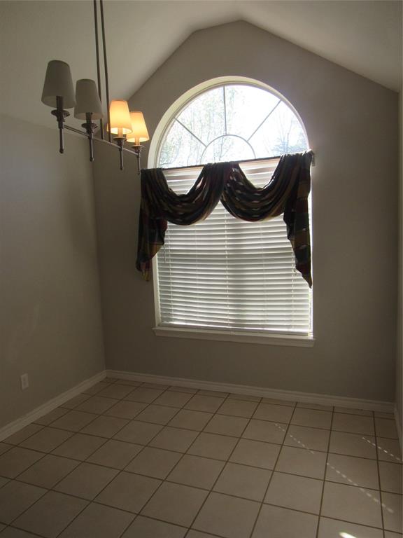 4019 East Fm 120 Denison, TX 75021 - Photo 15 of 39 an empty room with a fireplace and a window