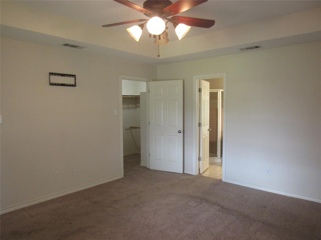 4019 East Fm 120 Denison, TX 75021 - Photo 20 of 39 an empty room with a bathroom and a chandelier fan