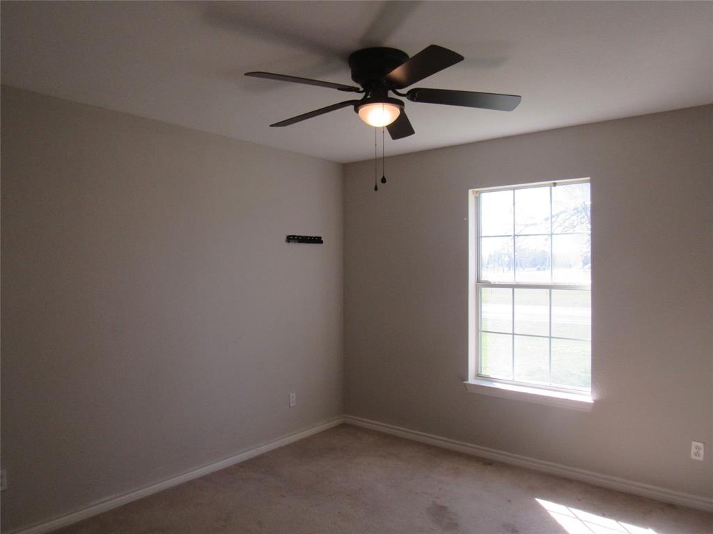 4019 East Fm 120 Denison, TX 75021 - Photo 27 of 39 an empty room with a window and a fan