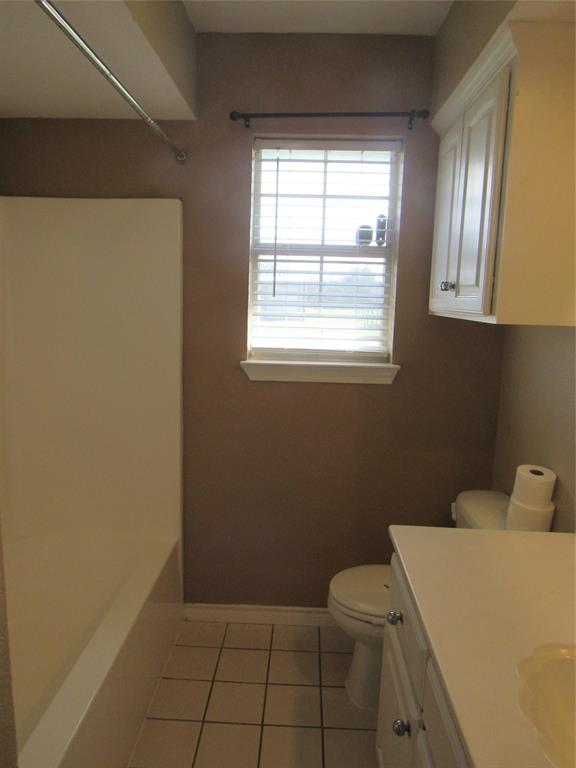 4019 East Fm 120 Denison, TX 75021 - Photo 29 of 39 a bathroom with a sink a toilet and a window