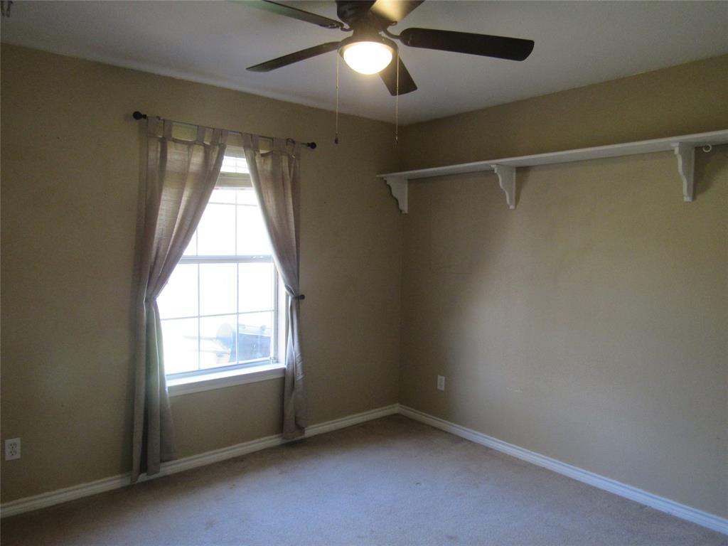 4019 East Fm 120 Denison, TX 75021 - Photo 31 of 39 an empty room with a window and a fan