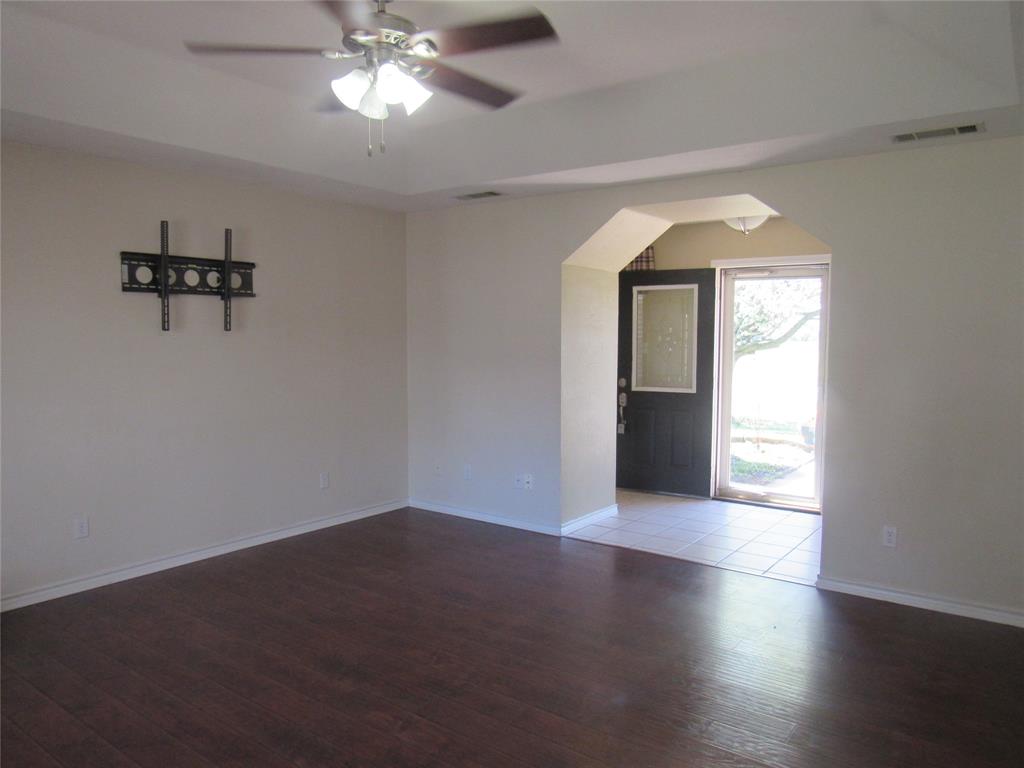 4019 East Fm 120 Denison, TX 75021 - Photo 33 of 39 a view of empty room with wooden floor and fan
