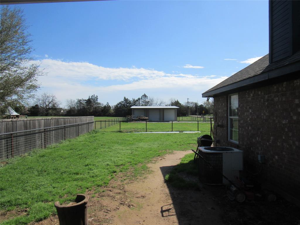 4019 East Fm 120 Denison, TX 75021 - Photo 34 of 39 a view of a backyard with a garden