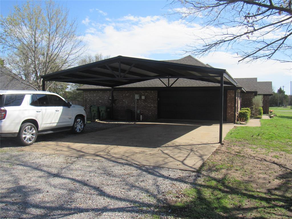 4019 East Fm 120 Denison, TX 75021 - Photo 4 of 39 a view of a car parked in front of a house