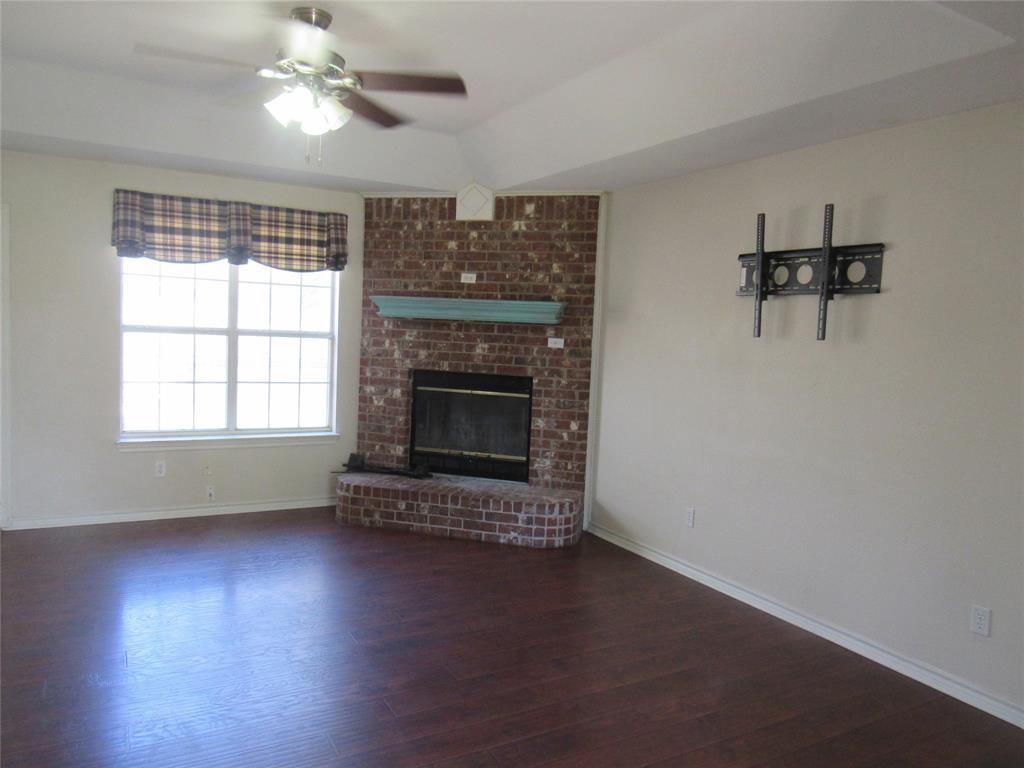 4019 East Fm 120 Denison, TX 75021 - Photo 9 of 39 wooden floor fireplace and windows in an empty room