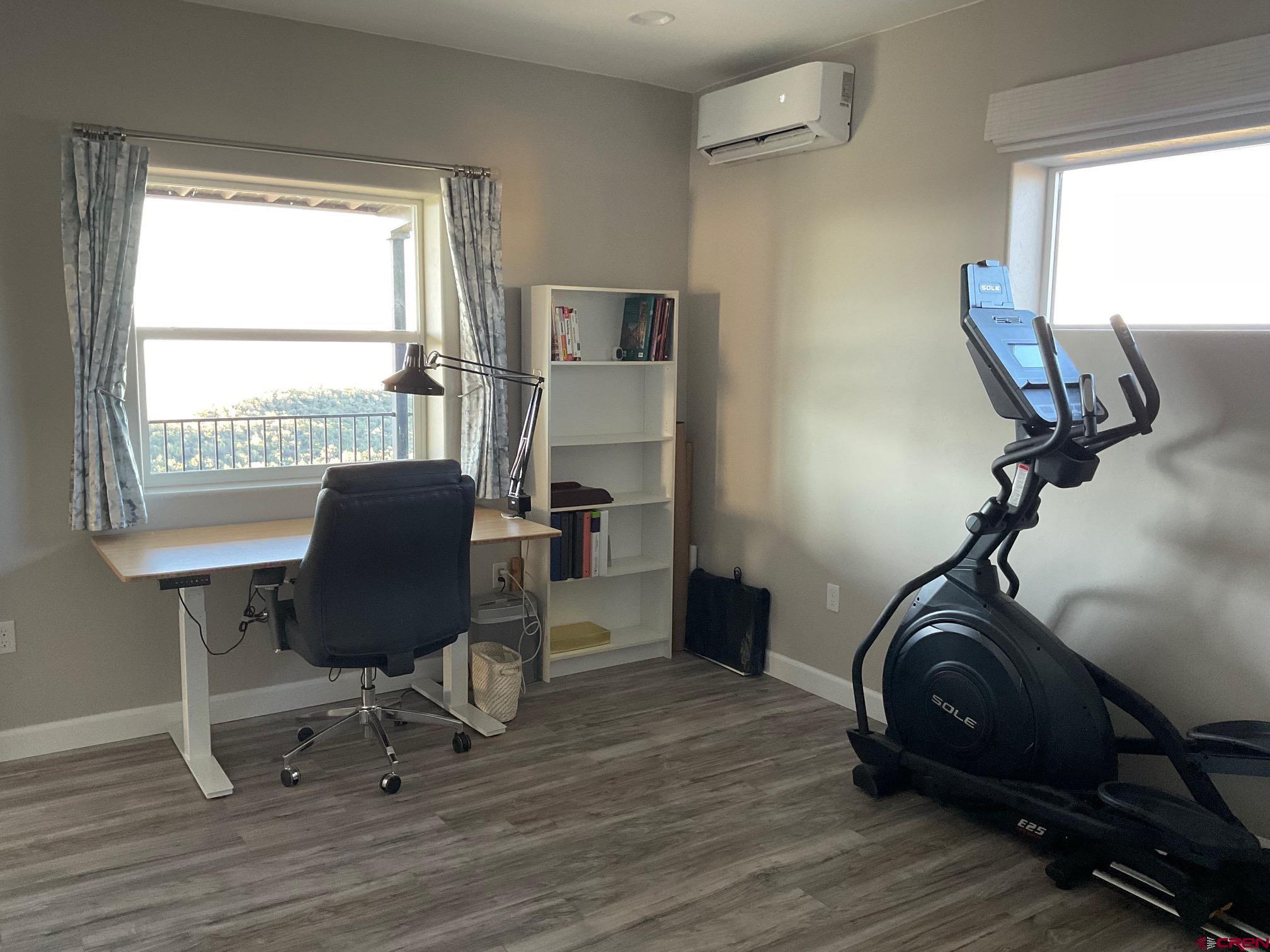 24203 Valley View Circle Cedaredge, CO 81413 - Photo 16 of 41 a view of a workspace with furniture and a window