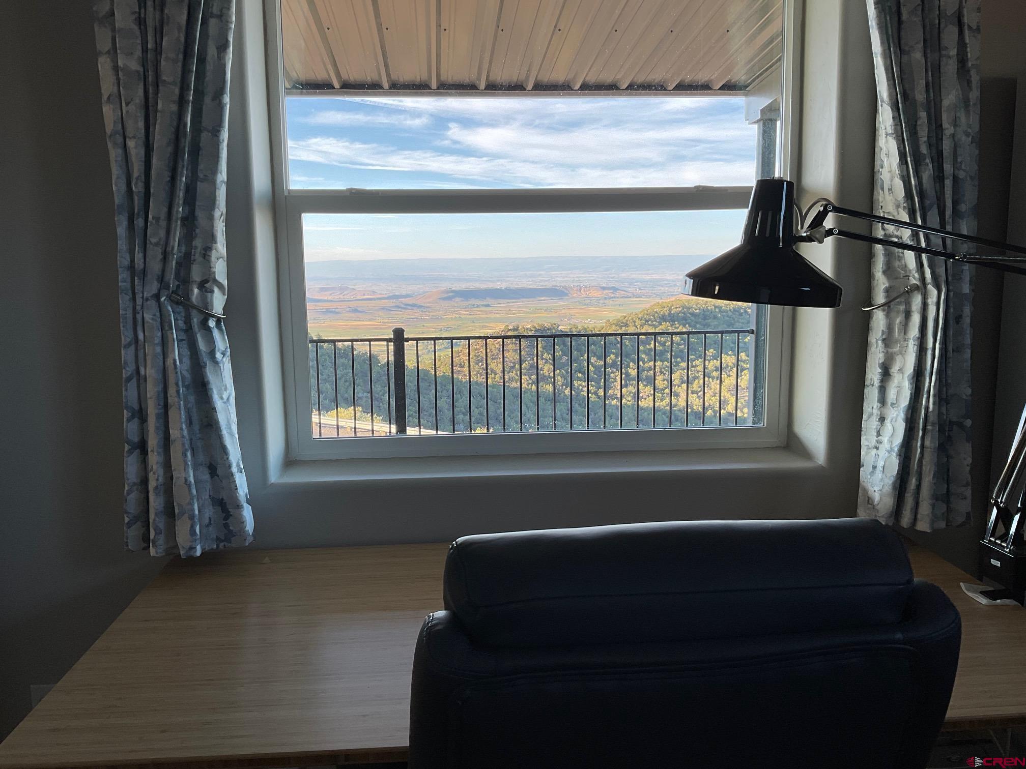 24203 Valley View Circle Cedaredge, CO 81413 - Photo 18 of 41 a bathroom with a bathtub and window