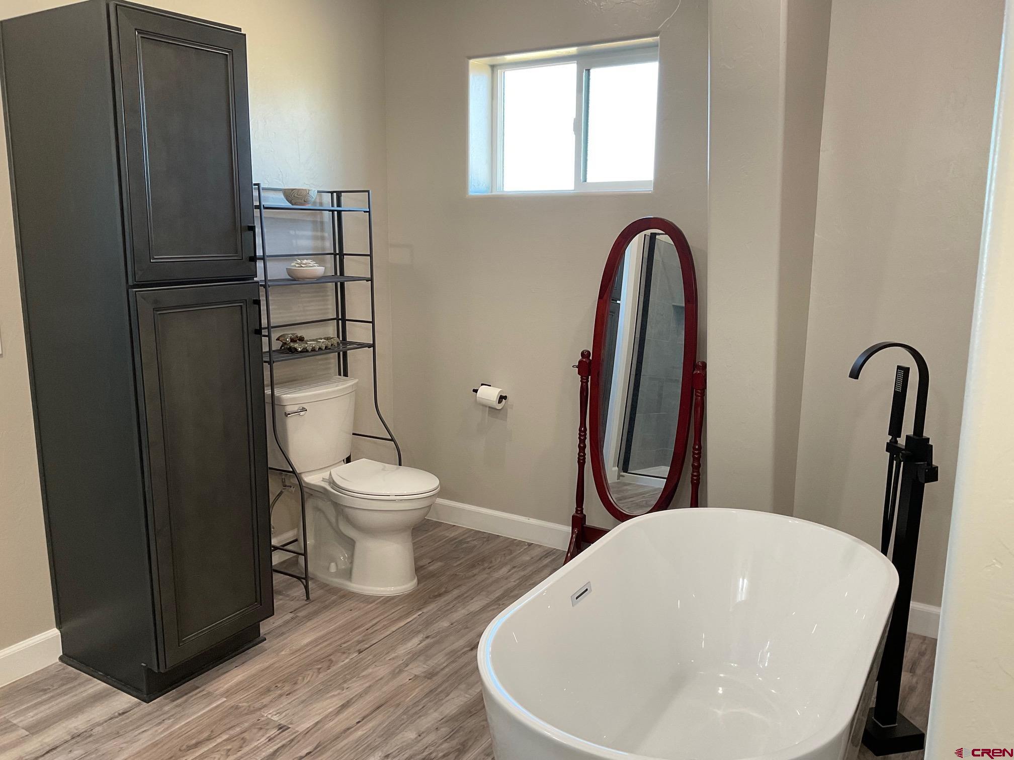 24203 Valley View Circle Cedaredge, CO 81413 - Photo 22 of 41 a bathroom with a toilet and a sink