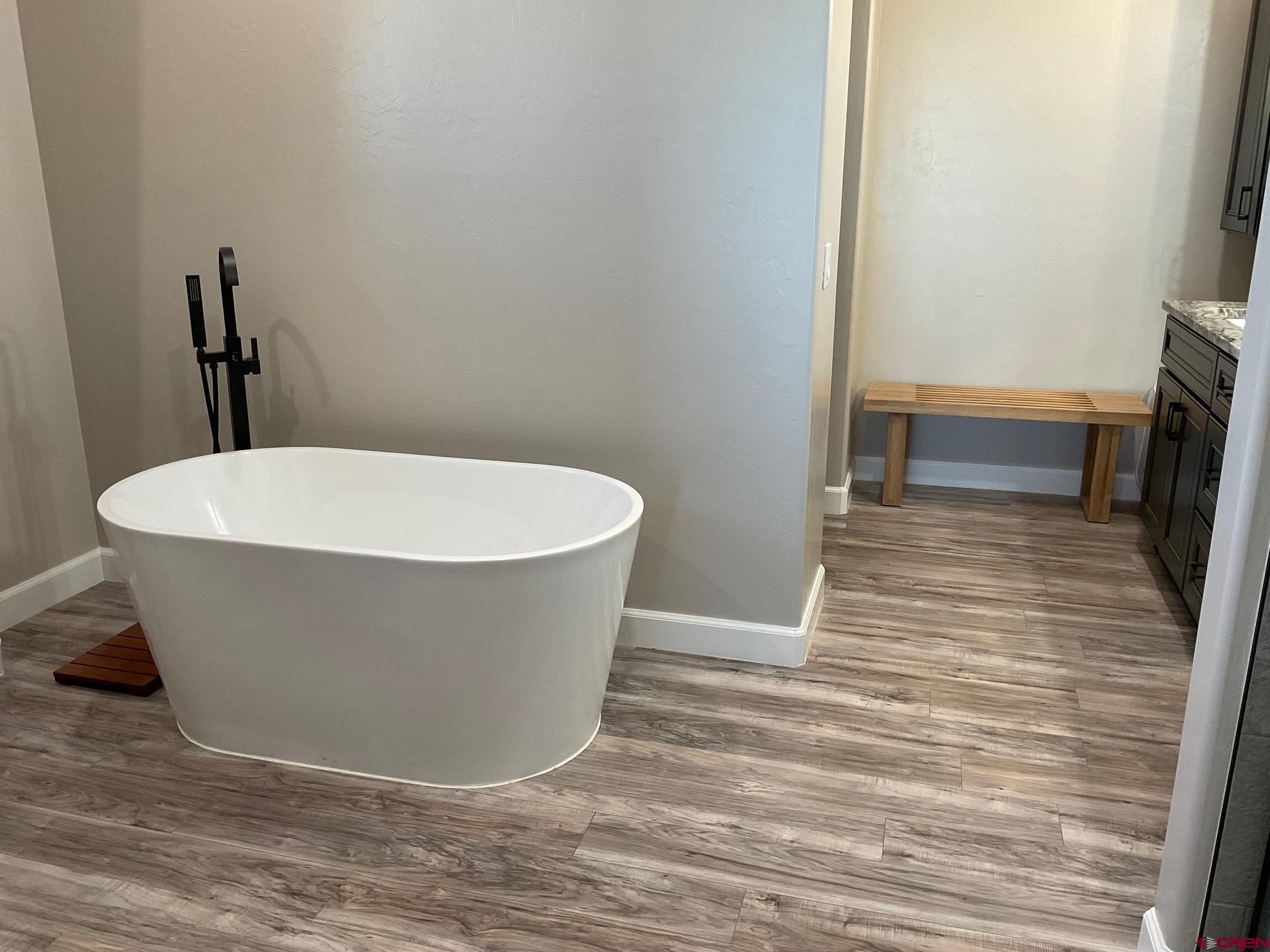 24203 Valley View Circle Cedaredge, CO 81413 - Photo 23 of 41 a view of a bathtub in a bathroom