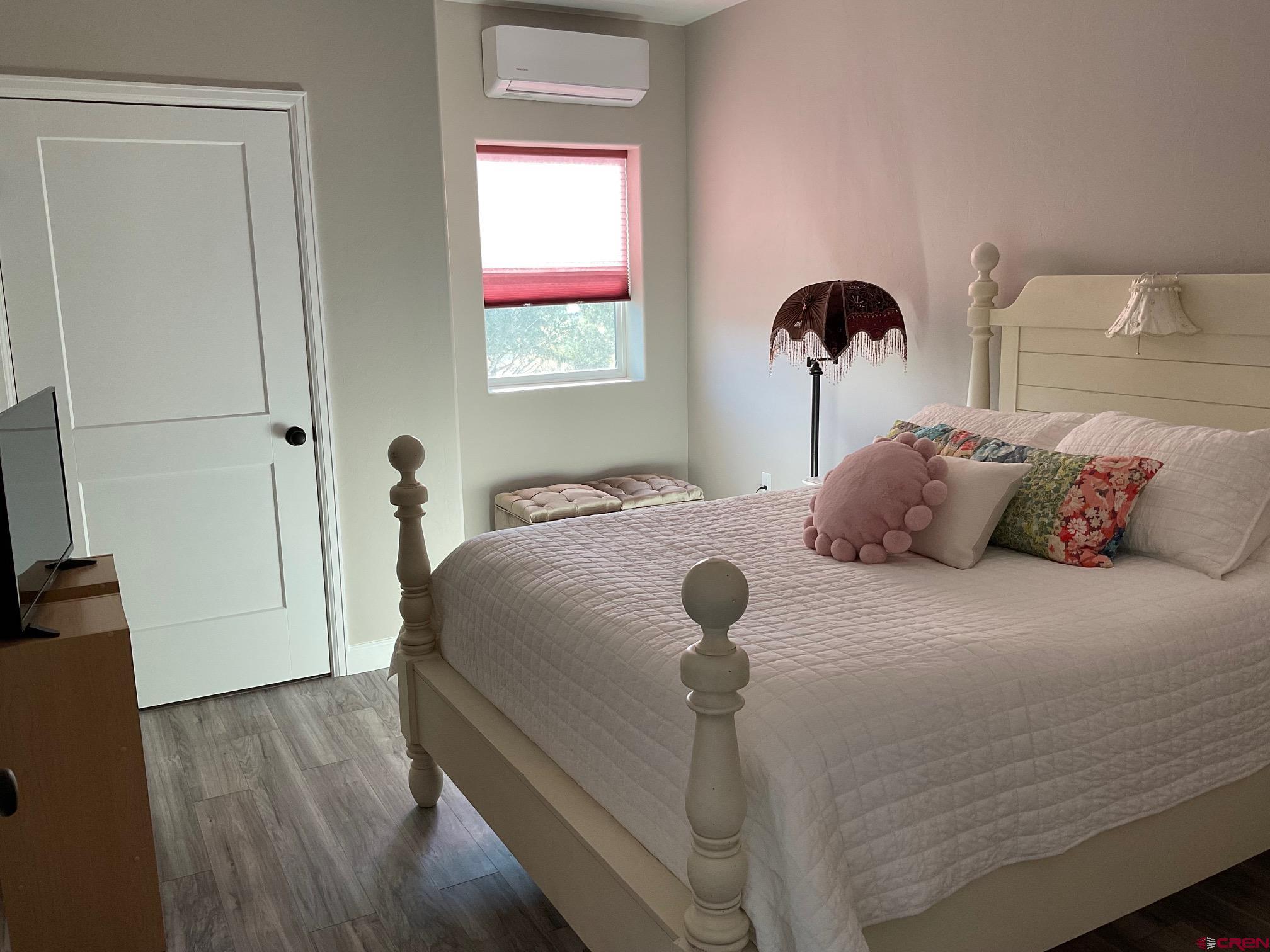 24203 Valley View Circle Cedaredge, CO 81413 - Photo 24 of 41 a bedroom with a bed and a dresser