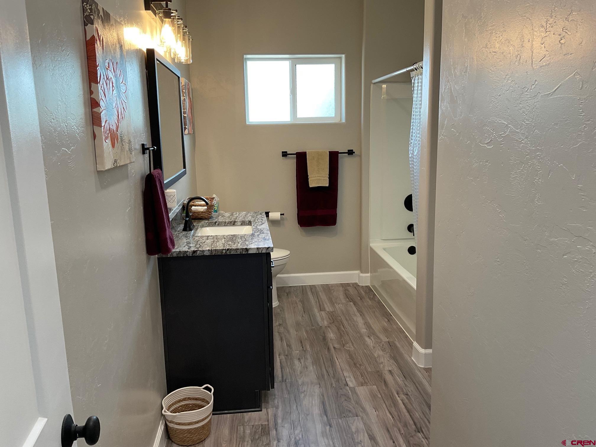 24203 Valley View Circle Cedaredge, CO 81413 - Photo 25 of 41 a bathroom with a sink and a mirror