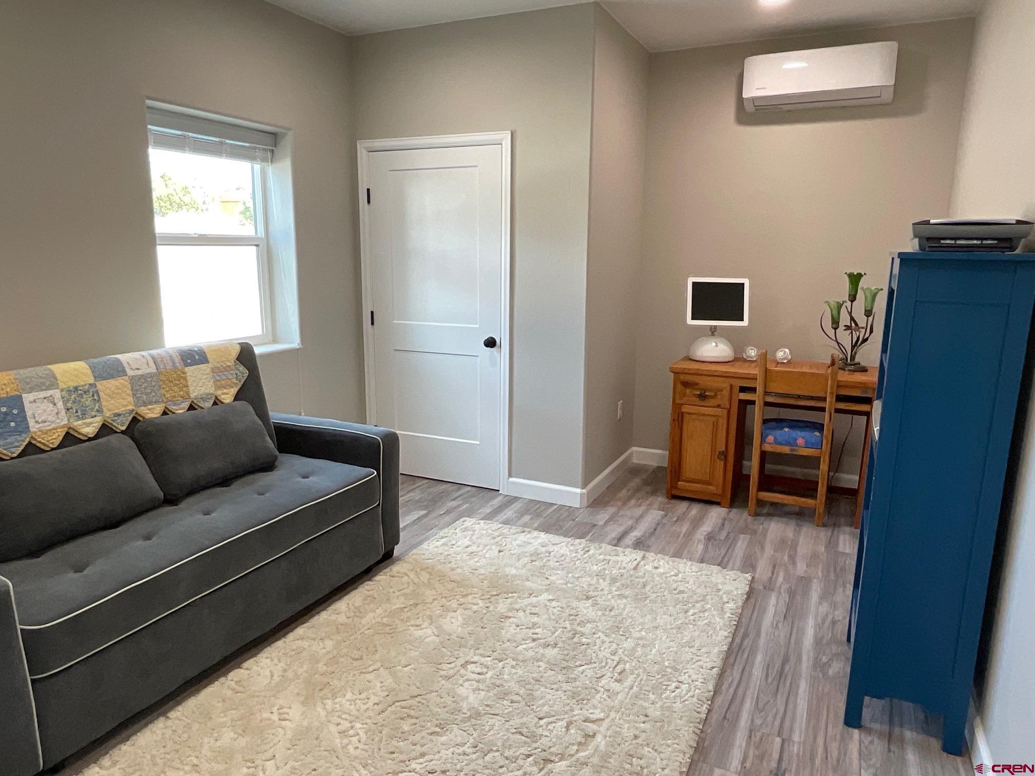 24203 Valley View Circle Cedaredge, CO 81413 - Photo 29 of 41 a living room with furniture and a open kitchen view