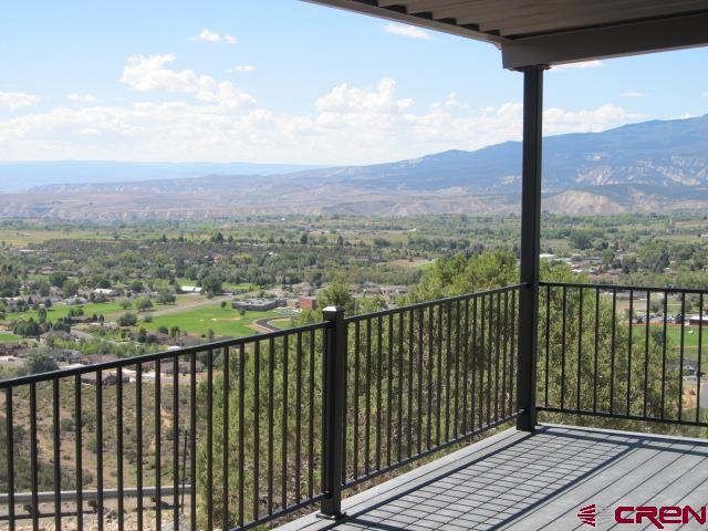 24203 Valley View Circle Cedaredge, CO 81413 - Photo 3 of 41 a view of city and mountain from a balcony