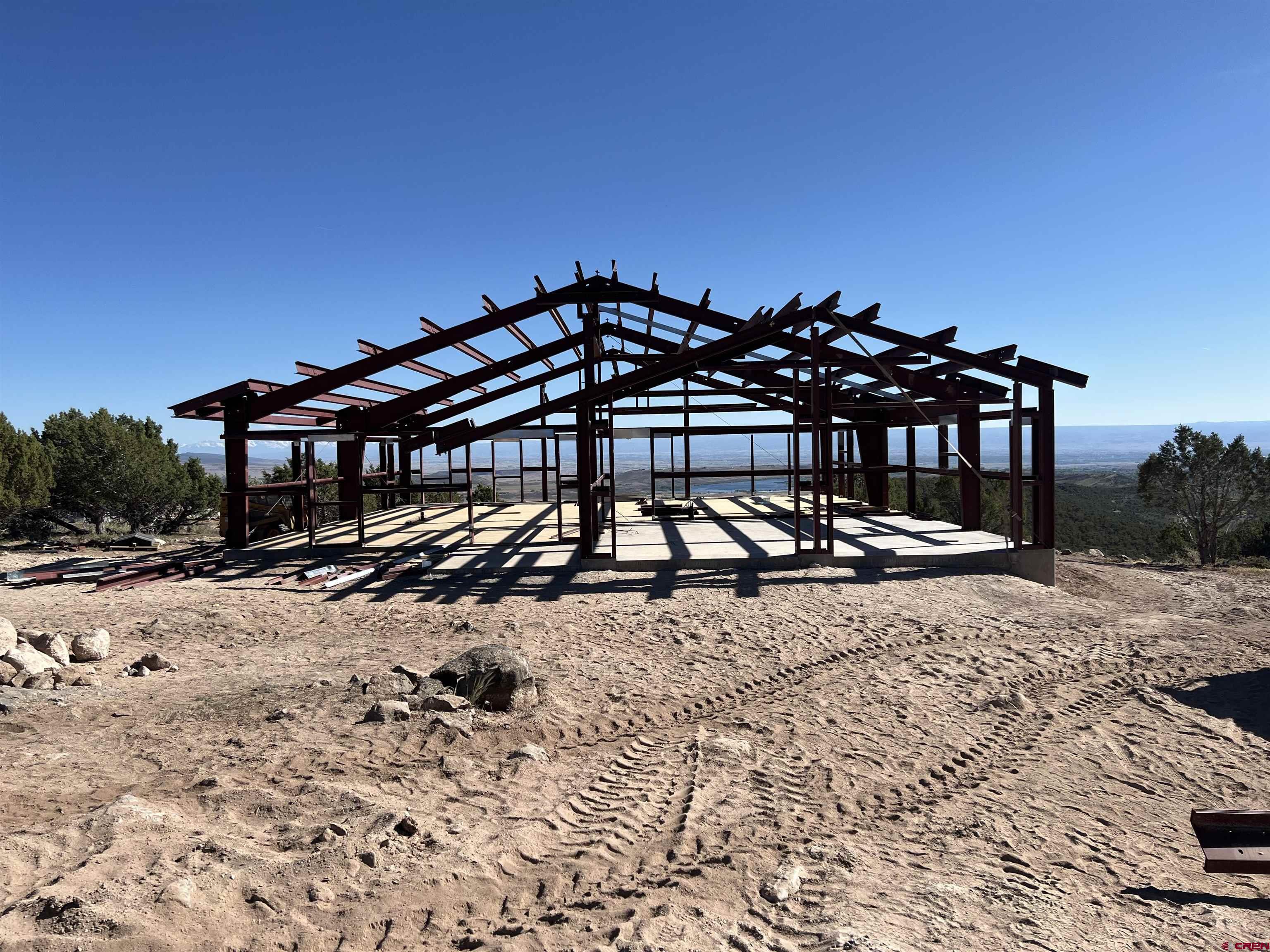 24203 Valley View Circle Cedaredge, CO 81413 - Photo 41 of 41 a view of a blue house with a yard and sitting area