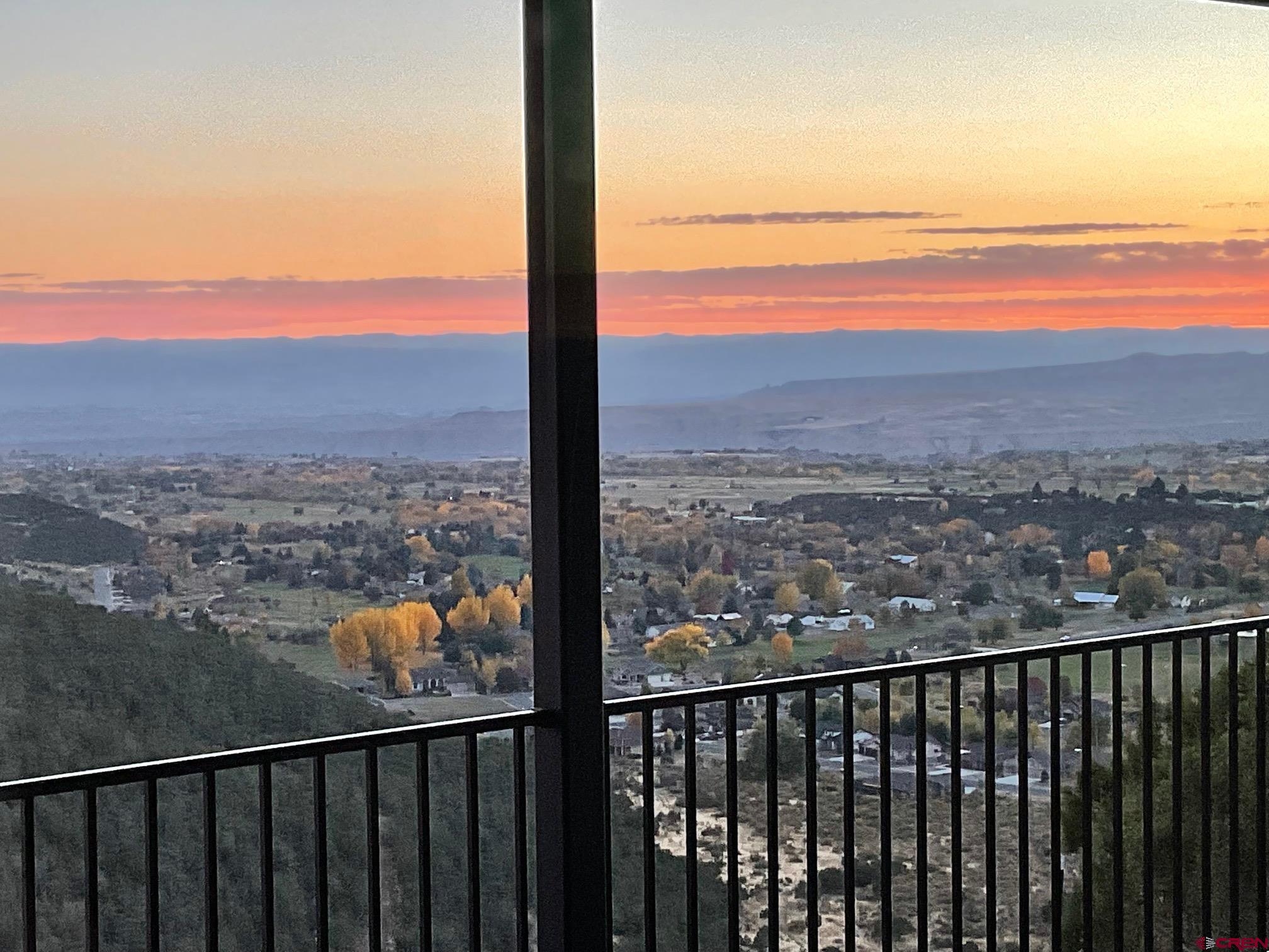 24203 Valley View Circle Cedaredge, CO 81413 - Photo 5 of 41 a view of city and mountain from a balcony