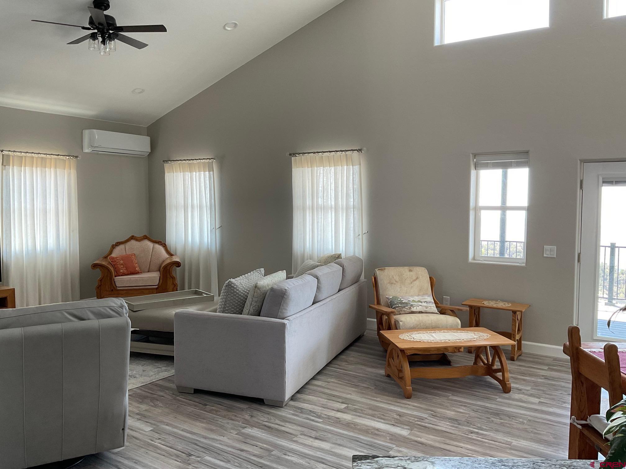 24203 Valley View Circle Cedaredge, CO 81413 - Photo 7 of 41 a living room with furniture and a wooden floor