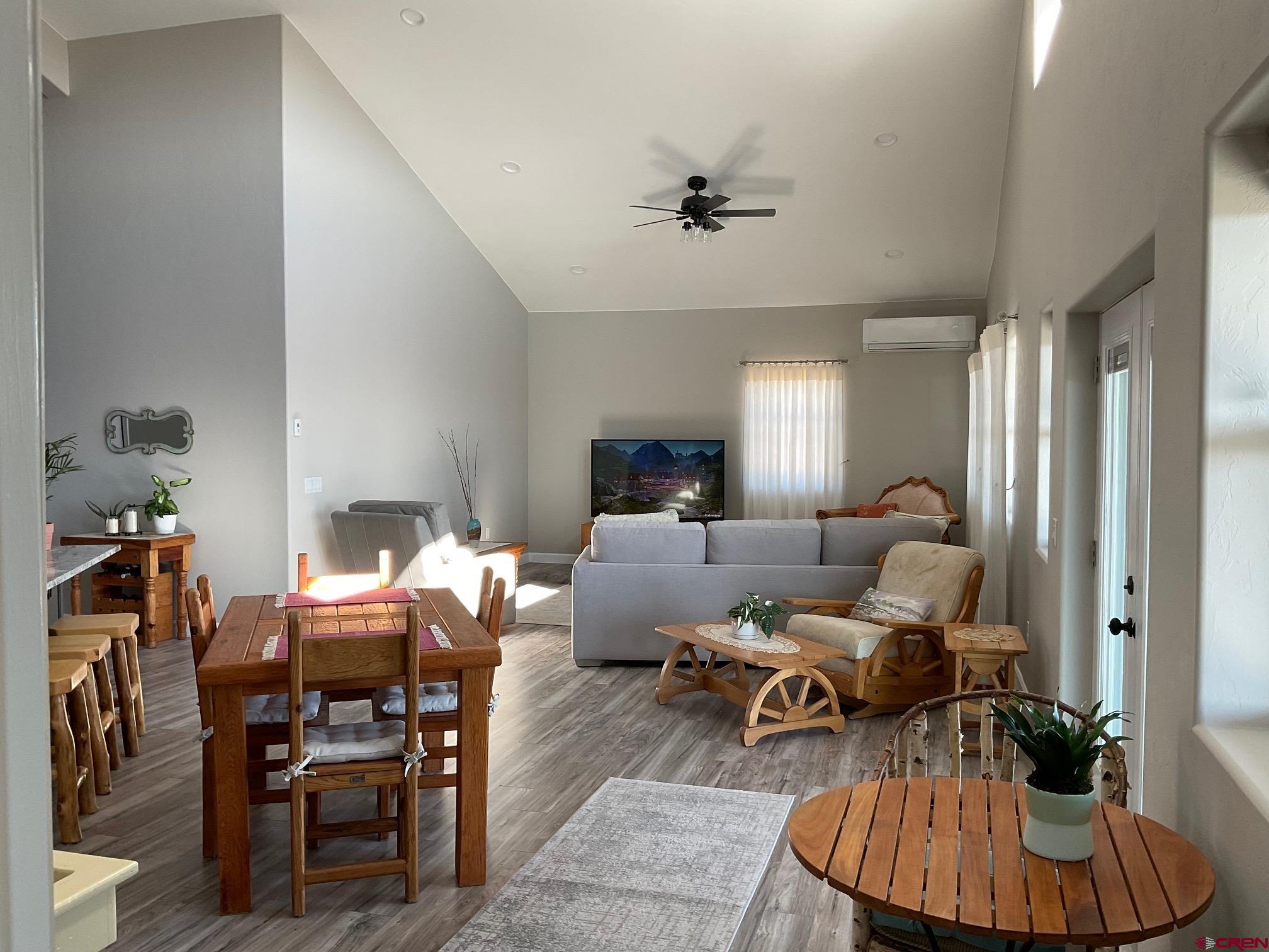 24203 Valley View Circle Cedaredge, CO 81413 - Photo 8 of 41 a living room with furniture and a view of kitchen