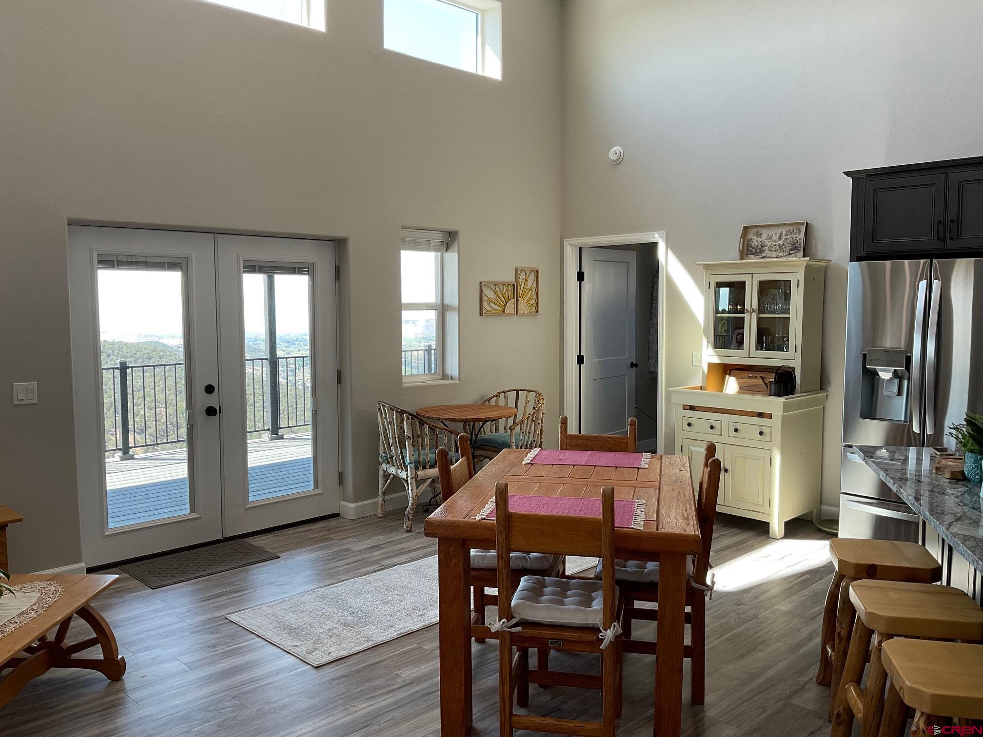 24203 Valley View Circle Cedaredge, CO 81413 - Photo 9 of 41 a dining room with furniture and window