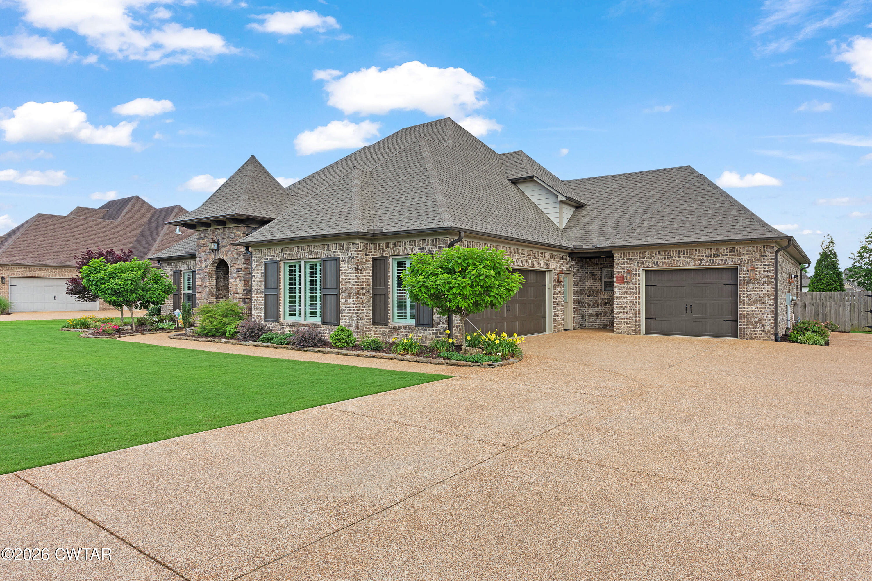 34 Cheddleton Cove Jackson, TN 38305 - Photo 32 of 32 a front view of a house with a yard and garage
