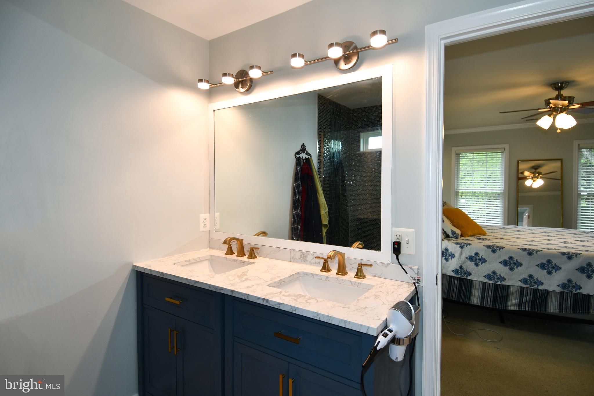 486 Tiger Valley Road Washington, VA 22747 - Photo 47 of 70 a bathroom with a sink and a mirror