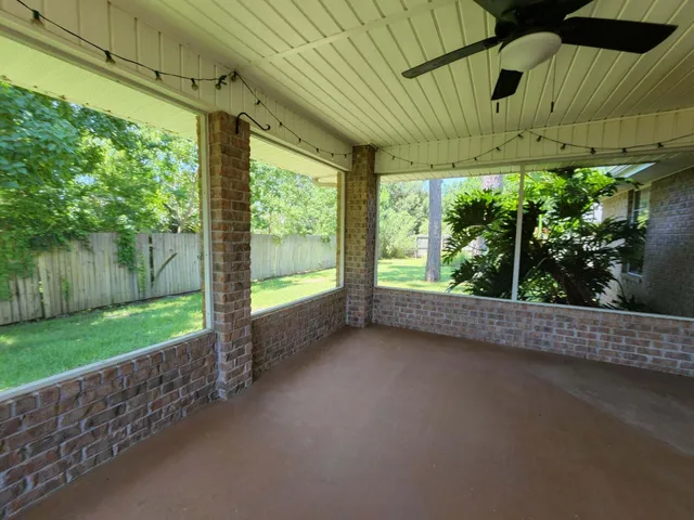 a view of a room with a porch and outdoor seating