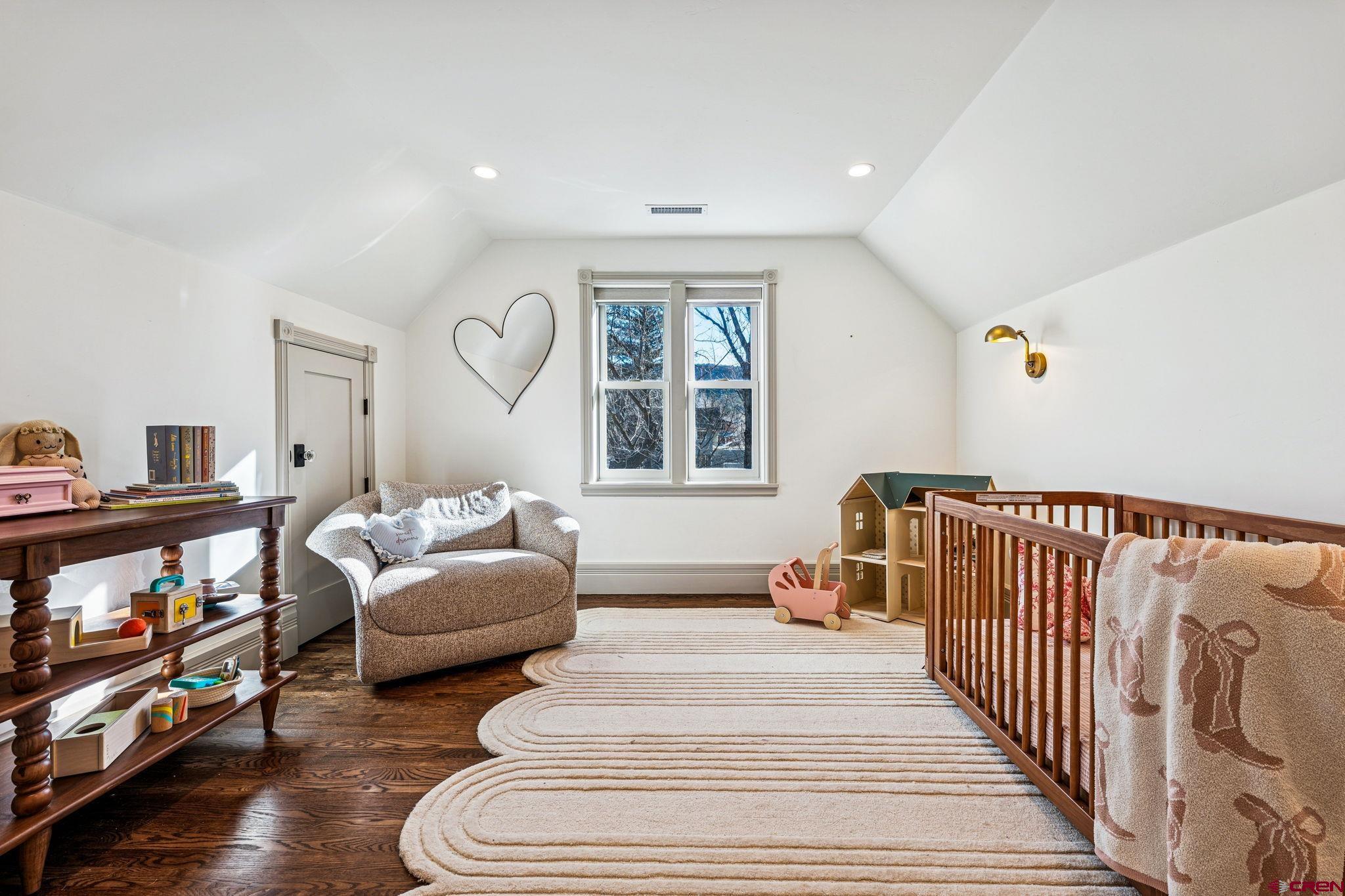 773 East 3rd Avenue Durango, CO 81301 - Photo 24 of 45 a spacious bedroom with a bed and a large window
