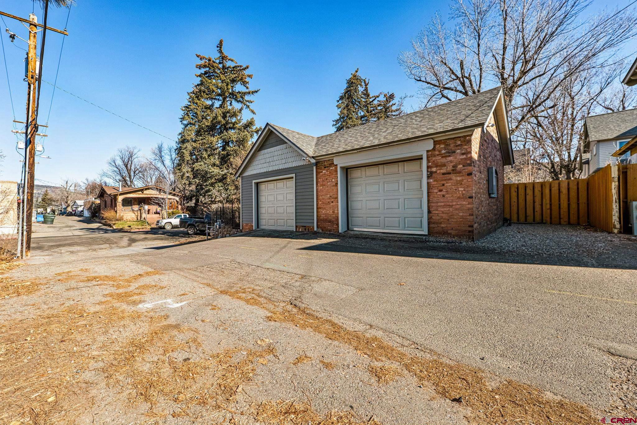 773 East 3rd Avenue Durango, CO 81301 - Photo 30 of 45 a front view of a house with a yard and garage