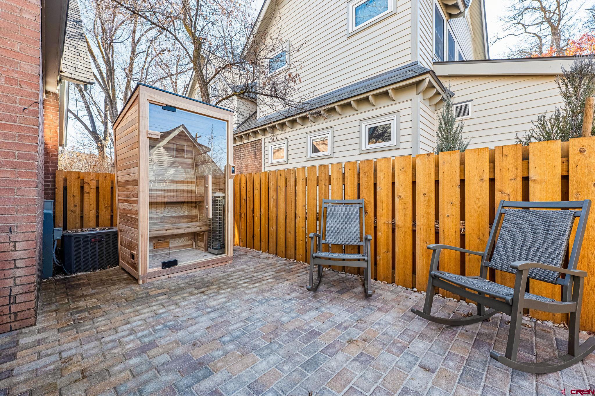 773 East 3rd Avenue Durango, CO 81301 - Photo 43 of 45 a backyard of a house with barbeque oven table and chairs