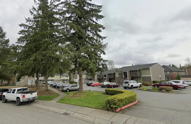 a view of a cars parked in front of a house