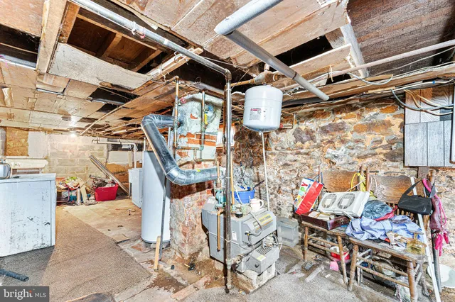 a view of a patio with table and chairs and potted plants