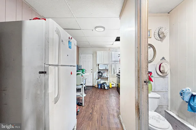 a bathroom with a toilet a sink and a mirror