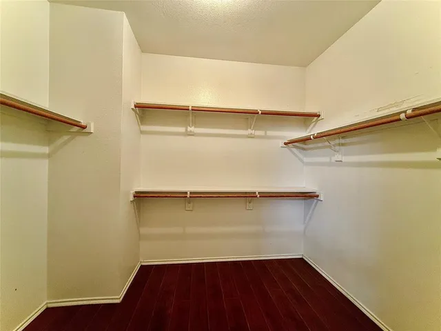 a view of storage and utility room with empty racks