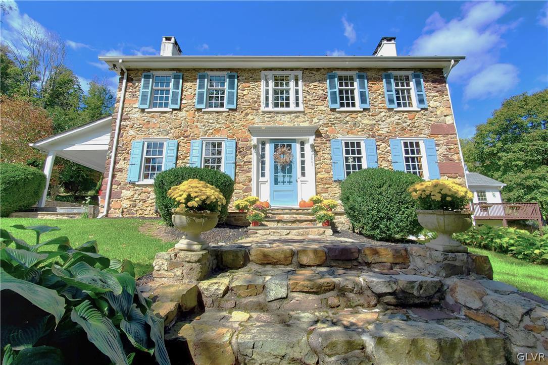 2884 Gallows Hill Road Riegelsville, PA 18077 - Photo 1 of 50 a front view of a house with garden