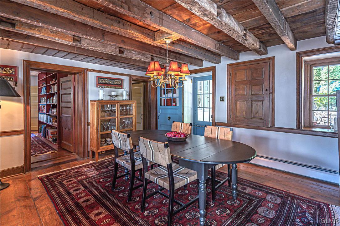 2884 Gallows Hill Road Riegelsville, PA 18077 - Photo 11 of 50 a dining room with furniture a chandelier and wooden floor