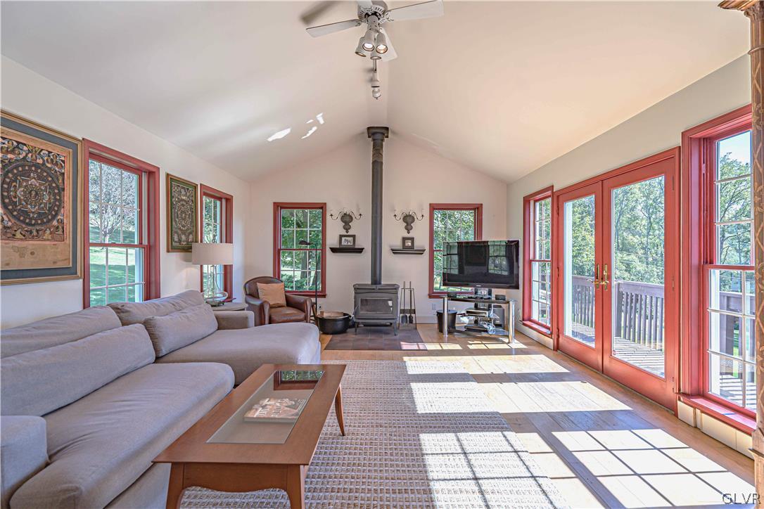 2884 Gallows Hill Road Riegelsville, PA 18077 - Photo 16 of 50 a living room with furniture and large windows