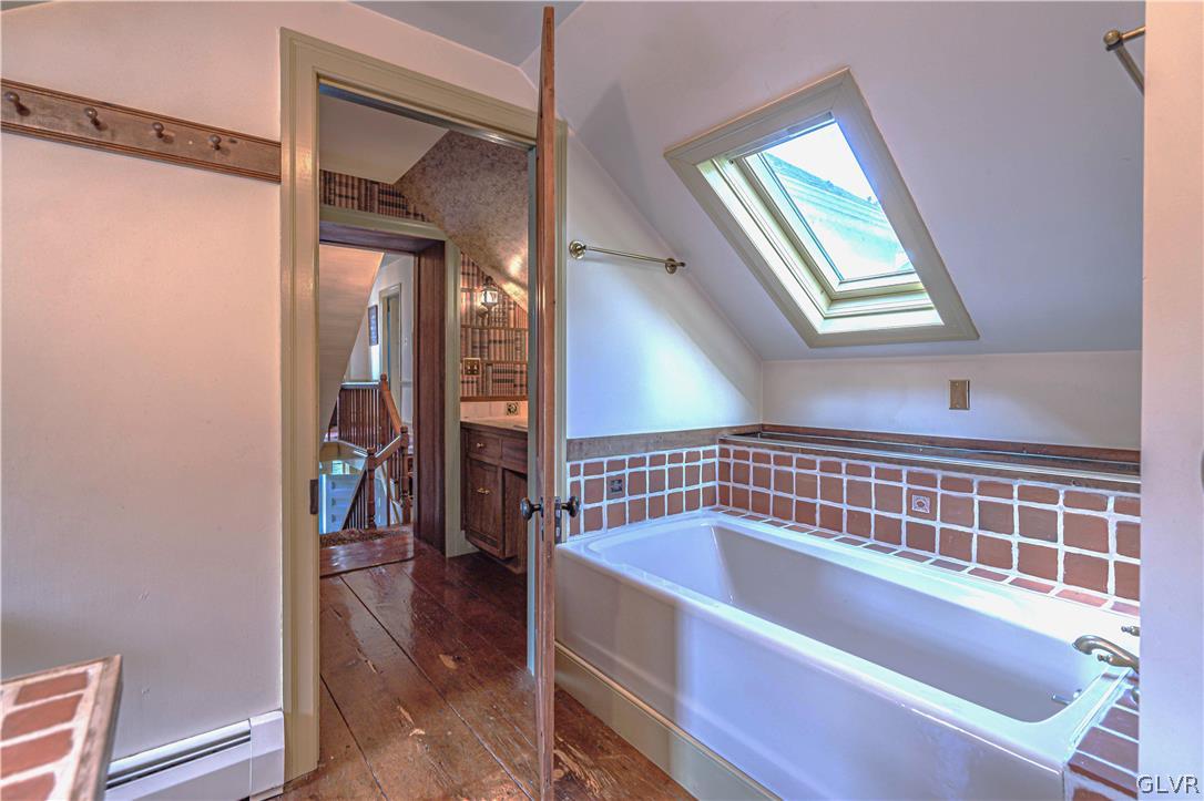 2884 Gallows Hill Road Riegelsville, PA 18077 - Photo 25 of 50 a bathroom with a bathtub and a shower