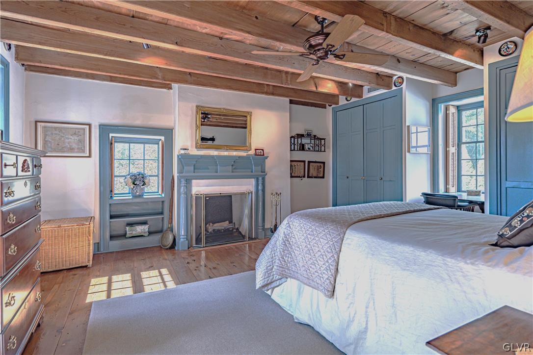 2884 Gallows Hill Road Riegelsville, PA 18077 - Photo 26 of 50 a spacious bedroom with a bed and a fireplace